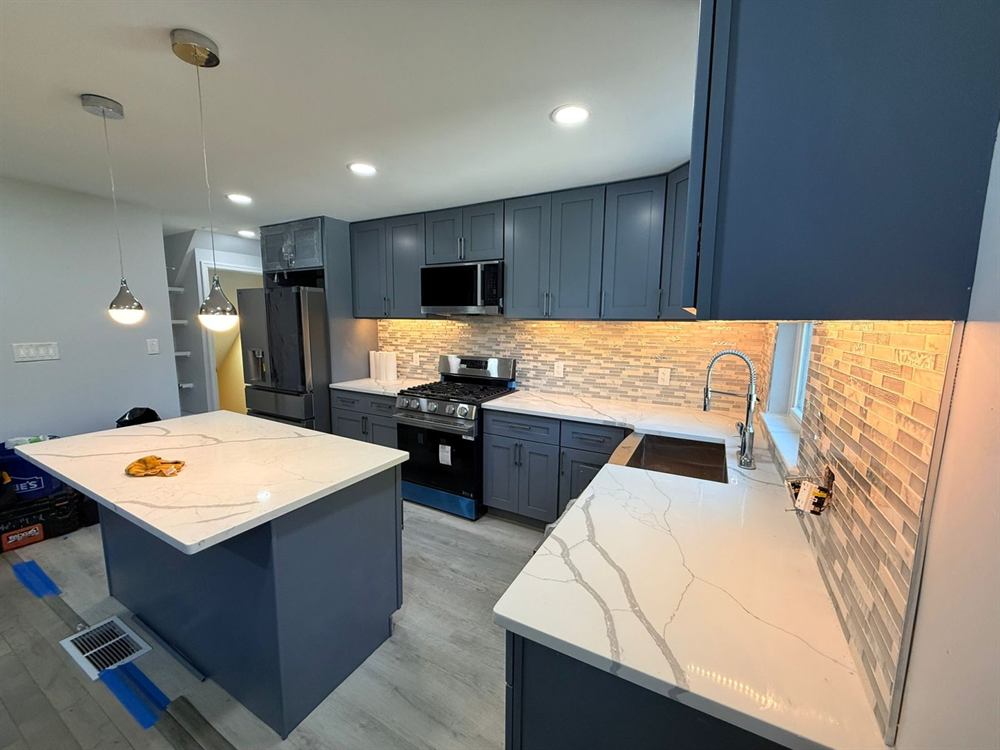 cabinet installation in progress during kitchen renovation project